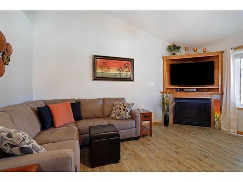 114 Southshore Drive East, Brooks, AB - Indoor Photo Showing Living Room With Fireplace