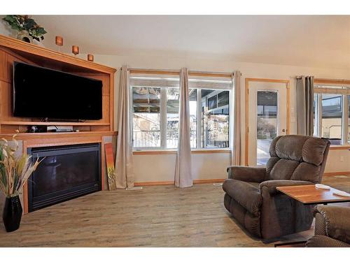 114 Southshore Drive East, Brooks, AB - Indoor Photo Showing Living Room With Fireplace