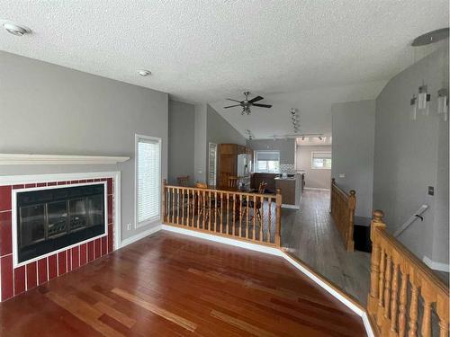 28 Parkland Way East, Brooks, AB - Indoor Photo Showing Living Room With Fireplace