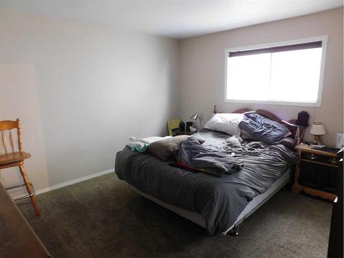 76 Blazier Park Street East, Brooks, AB - Indoor Photo Showing Bedroom