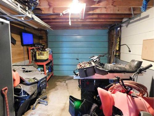 76 Blazier Park Street East, Brooks, AB - Indoor Photo Showing Garage