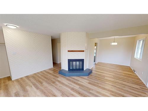 106 181057 Hwy 873, Rural Newell, County Of, AB - Indoor Photo Showing Living Room With Fireplace