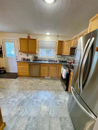 131 Wildrose Avenue West, Brooks, AB - Indoor Photo Showing Kitchen With Double Sink