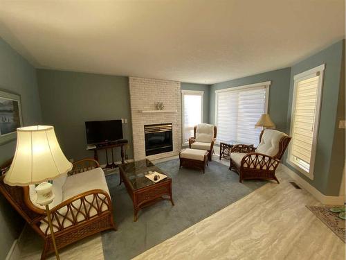 724 2 Street East, Brooks, AB - Indoor Photo Showing Living Room With Fireplace