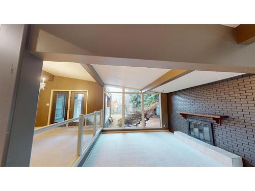 11 Laurel Place, Brooks, AB - Indoor With Fireplace