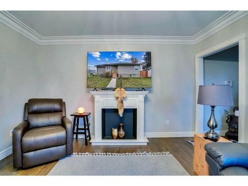 201 4 Avenue West, Hanna, AB - Indoor Photo Showing Living Room With Fireplace