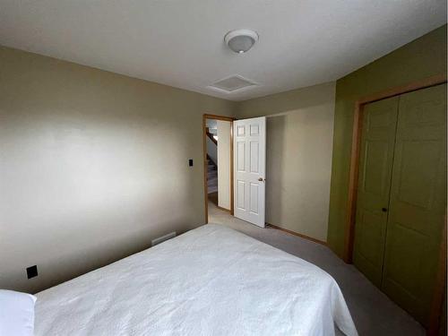 84 Upland Street, Brooks, AB - Indoor Photo Showing Bedroom