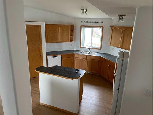 84 Upland Street, Brooks, AB - Indoor Photo Showing Kitchen With Double Sink