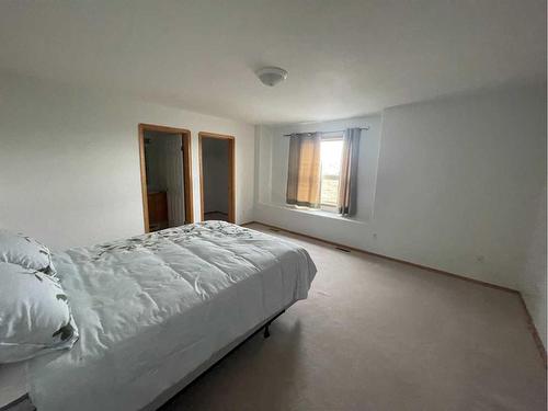 84 Upland Street, Brooks, AB - Indoor Photo Showing Bedroom