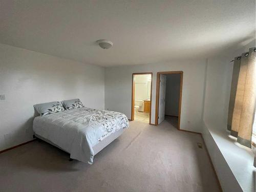 84 Upland Street, Brooks, AB - Indoor Photo Showing Bedroom