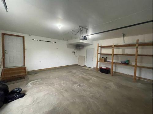 84 Upland Street, Brooks, AB - Indoor Photo Showing Garage