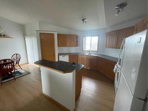 84 Upland Street, Brooks, AB - Indoor Photo Showing Kitchen With Double Sink