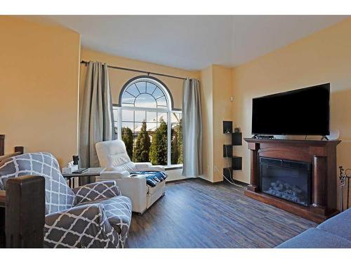 188 Upland Avenue West, Brooks, AB - Indoor Photo Showing Living Room With Fireplace