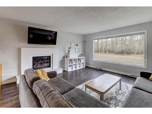 1401 Riverside Drive East, Drumheller, AB - Indoor Photo Showing Living Room With Fireplace