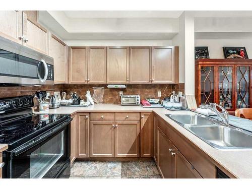 209-52 Cranfield Link Se, Calgary, AB - Indoor Photo Showing Kitchen With Double Sink