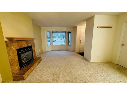 14-830 Birchwood Close, Drumheller, AB - Indoor With Fireplace