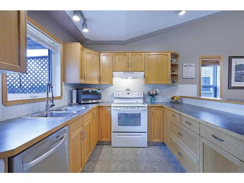 110 Upland Road, Brooks, AB - Indoor Photo Showing Kitchen With Double Sink