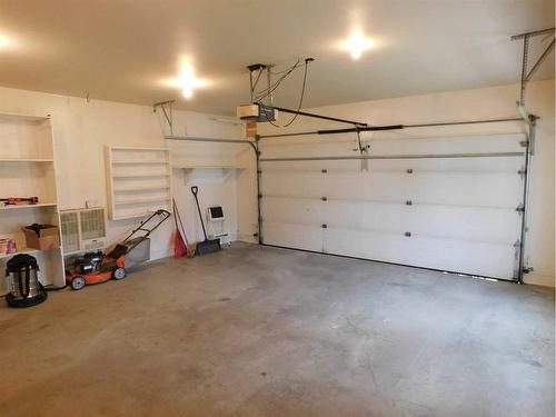 48 Kellington Close, Brooks, AB - Indoor Photo Showing Garage