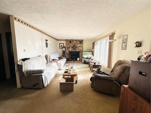 412 Main Street, Oyen, AB - Indoor Photo Showing Living Room With Fireplace