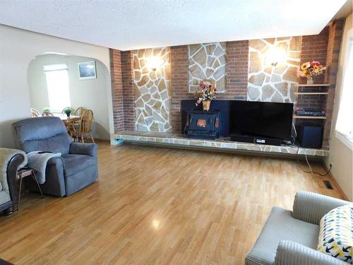 11 Fairview Avenue West, Brooks, AB - Indoor Photo Showing Living Room With Fireplace