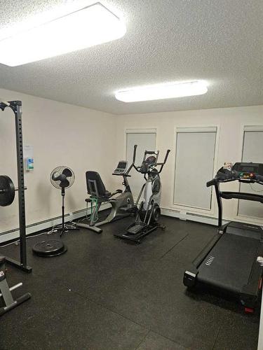 210-204 17 Street East, Brooks, AB - Indoor Photo Showing Gym Room