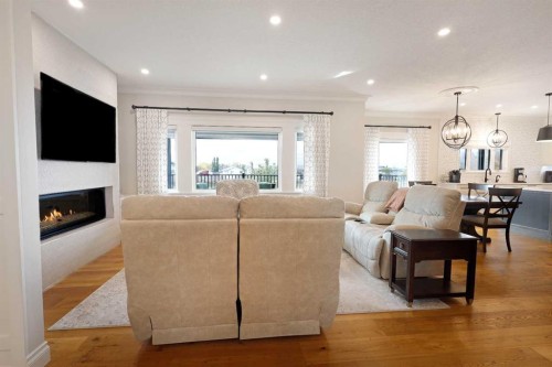 911 2 Avenue West, Brooks, AB - Indoor Photo Showing Living Room With Fireplace
