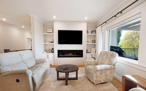 911 2 Avenue West, Brooks, AB - Indoor Photo Showing Living Room With Fireplace