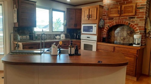 710 Bankview Close, Drumheller, AB - Indoor Photo Showing Other Room With Fireplace