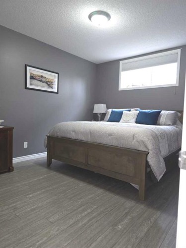 79 Park Place West, Brooks, AB - Indoor Photo Showing Bedroom