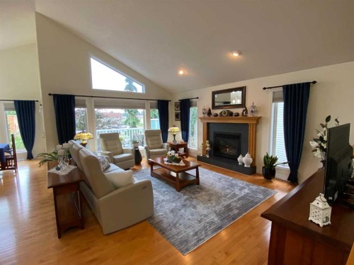 79 Park Place West, Brooks, AB - Indoor Photo Showing Living Room With Fireplace