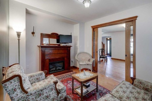 1507 2 Avenue Nw, Drumheller, AB - Indoor Photo Showing Living Room With Fireplace