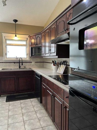 3930 Harmony Place, Taber, AB - Indoor Photo Showing Kitchen With Double Sink