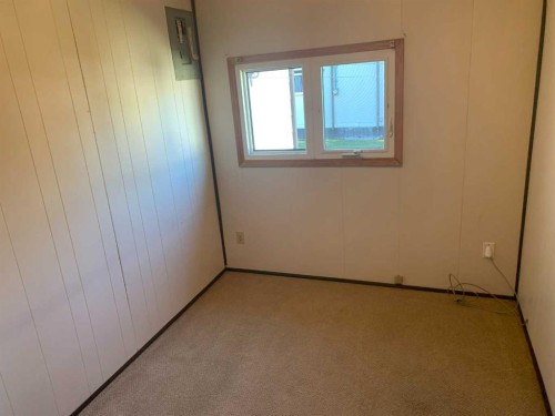 225 4 Street Street Nw, Sundre, AB - Indoor Photo Showing Other Room