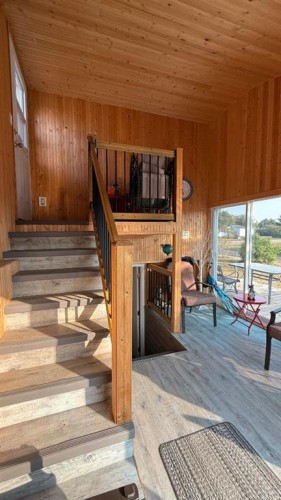 219 1 Avenue East, Youngstown, AB - Indoor Photo Showing Other Room With Fireplace