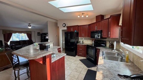 219 1 Avenue East, Youngstown, AB - Indoor Photo Showing Kitchen With Double Sink