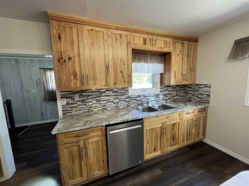 126 Harris Road, Taber, AB - Indoor Photo Showing Kitchen With Double Sink