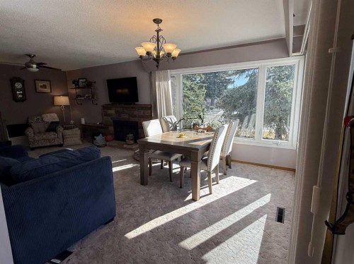 816 James Crescent, Hanna, AB - Indoor With Fireplace