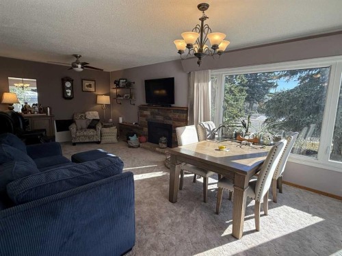 816 James Crescent, Hanna, AB - Indoor With Fireplace
