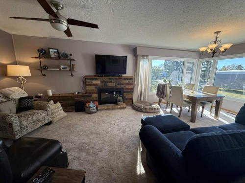 816 James Crescent, Hanna, AB - Indoor Photo Showing Living Room With Fireplace