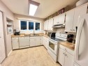 704 Bankview Drive, Drumheller, AB  - Indoor Photo Showing Kitchen With Double Sink 