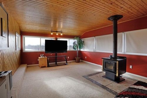 1120 2 Avenue East, Brooks, AB - Indoor Photo Showing Other Room With Fireplace