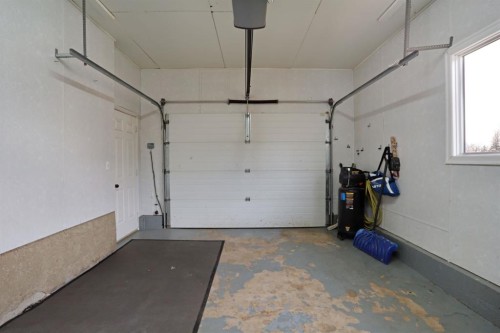 1120 2 Avenue East, Brooks, AB - Indoor Photo Showing Garage
