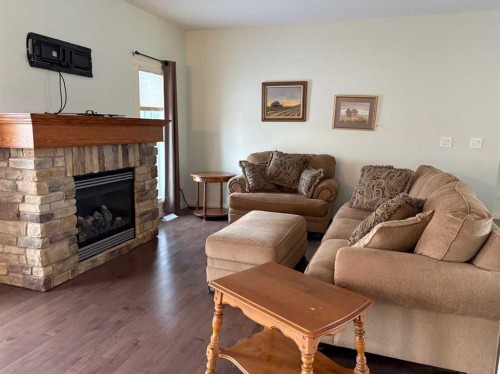 19 Viceroy Crescent, Olds, AB - Indoor Photo Showing Living Room With Fireplace