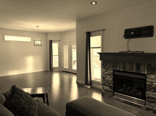 19 Viceroy Crescent, Olds, AB - Indoor Photo Showing Living Room With Fireplace