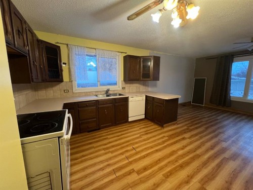 1914 North River Drive, Drumheller, AB - Indoor Photo Showing Kitchen With Double Sink