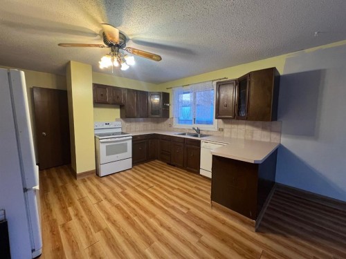 1914 North River Drive, Drumheller, AB - Indoor Photo Showing Kitchen With Double Sink