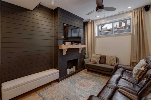 165 10 Avenue Se, Drumheller, AB - Indoor Photo Showing Living Room With Fireplace