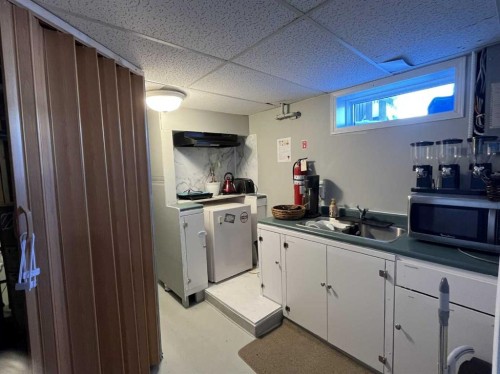 4915 57 Avenue, Taber, AB - Indoor Photo Showing Kitchen With Double Sink