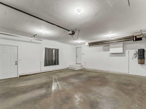24 Upland Place West, Brooks, AB - Indoor Photo Showing Garage