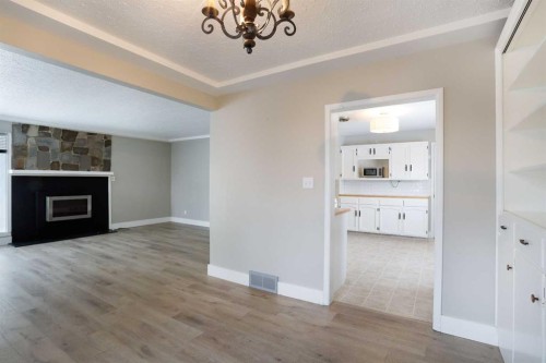 508 2 Avenue West, Brooks, AB - Indoor Photo Showing Other Room With Fireplace